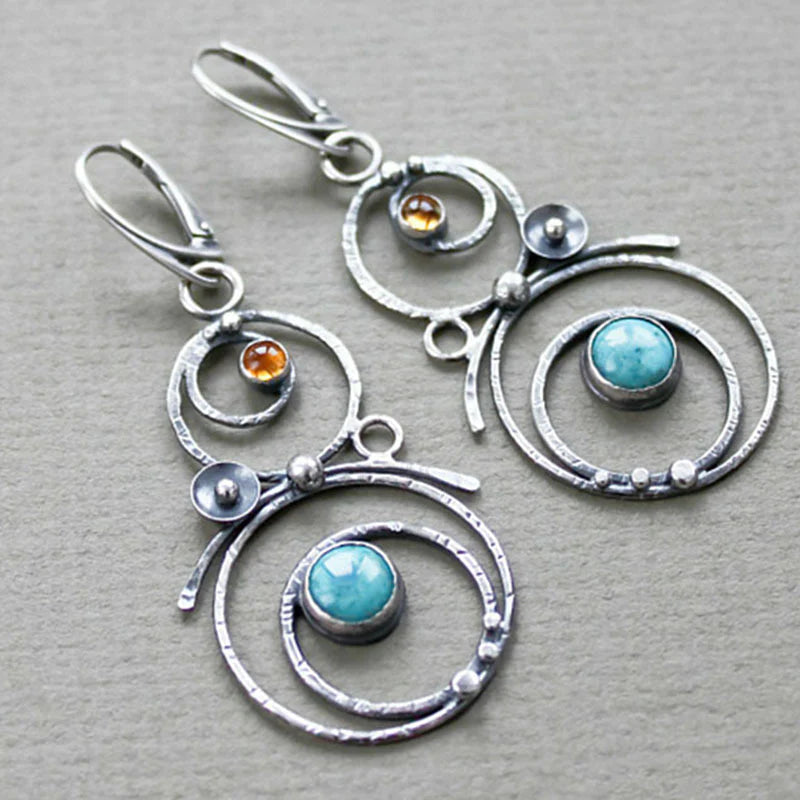 Silver-Tone Spiral Earrings with Blue Stone
