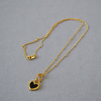 Black and White Heart Pendant Necklace in Gold Tone