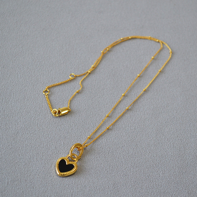 Black and White Heart Pendant Necklace in Gold Tone
