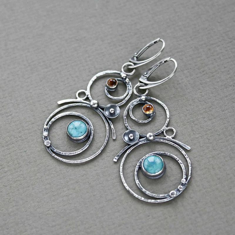Silver-Tone Spiral Earrings with Blue Stone