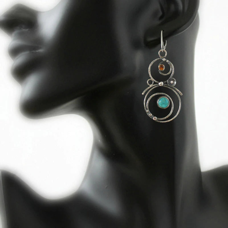 Silver-Tone Spiral Earrings with Blue Stone