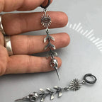Boho oorbellen met maskerhanger in zilverkleur