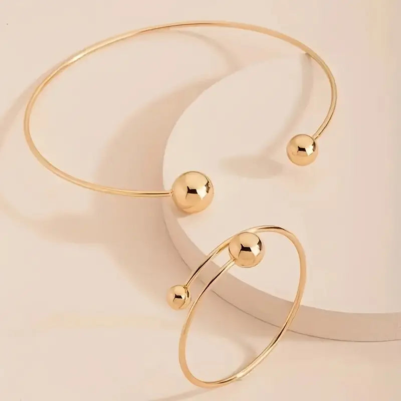 Minimalistische set van collier en open armband in twee metaaltinten