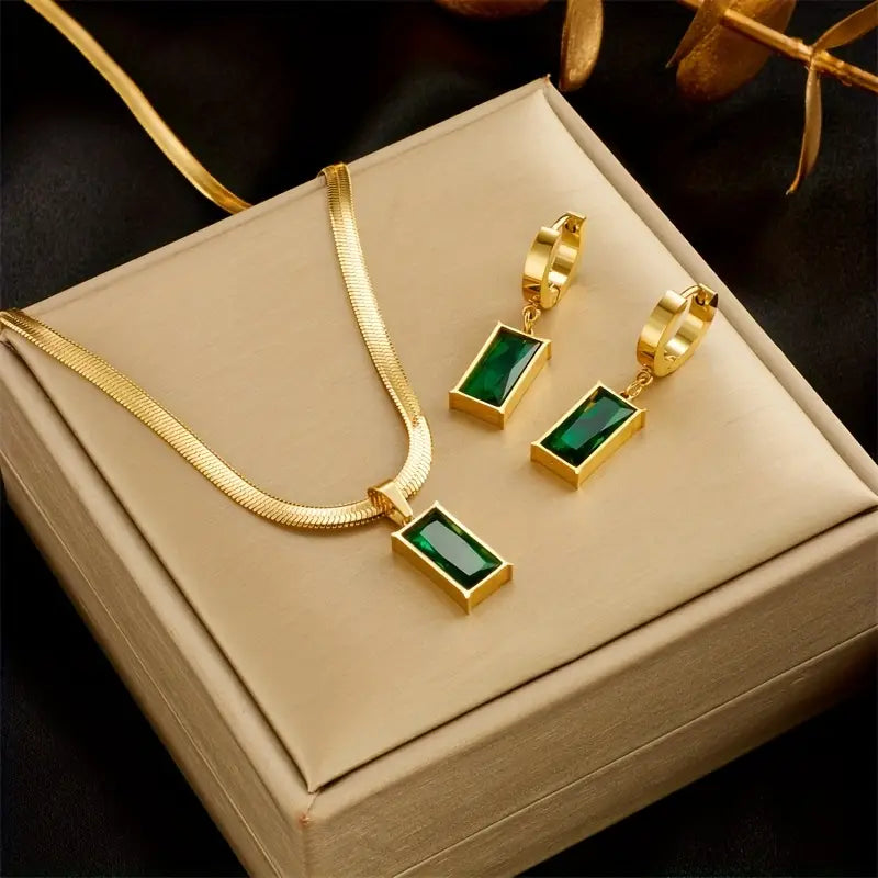Set met slangenketting en oorbellen met groene steen in goudkleur