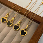 Black and White Heart Pendant Necklace in Gold Tone