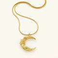 Goudkleurige ketting met hanger met bloem en maan