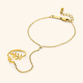 Goudkleurige armband met hangende bladbedel