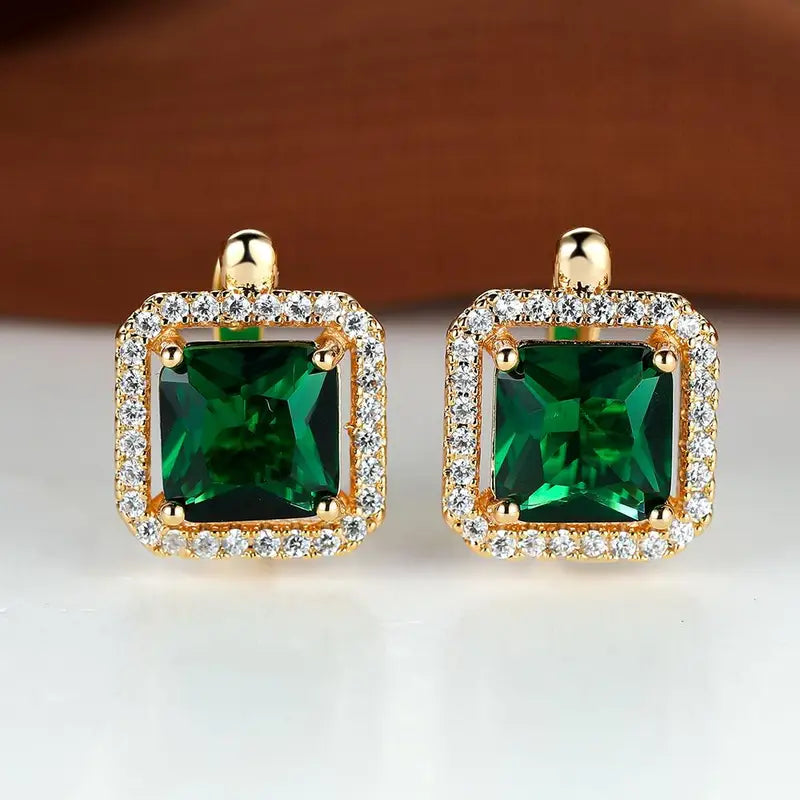 Halo-oorknopjes met groene vierkante zirkonia in goudkleur