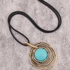 Lange ketting van zwart waskoord met turquoise steen
