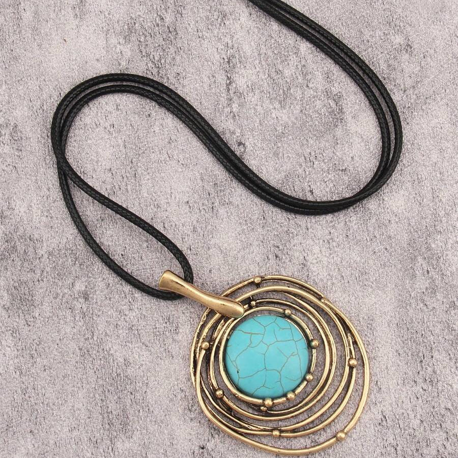 Lange ketting van zwart waskoord met turquoise steen