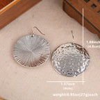 Vintage gehamerde oorhangers met grote schijf
