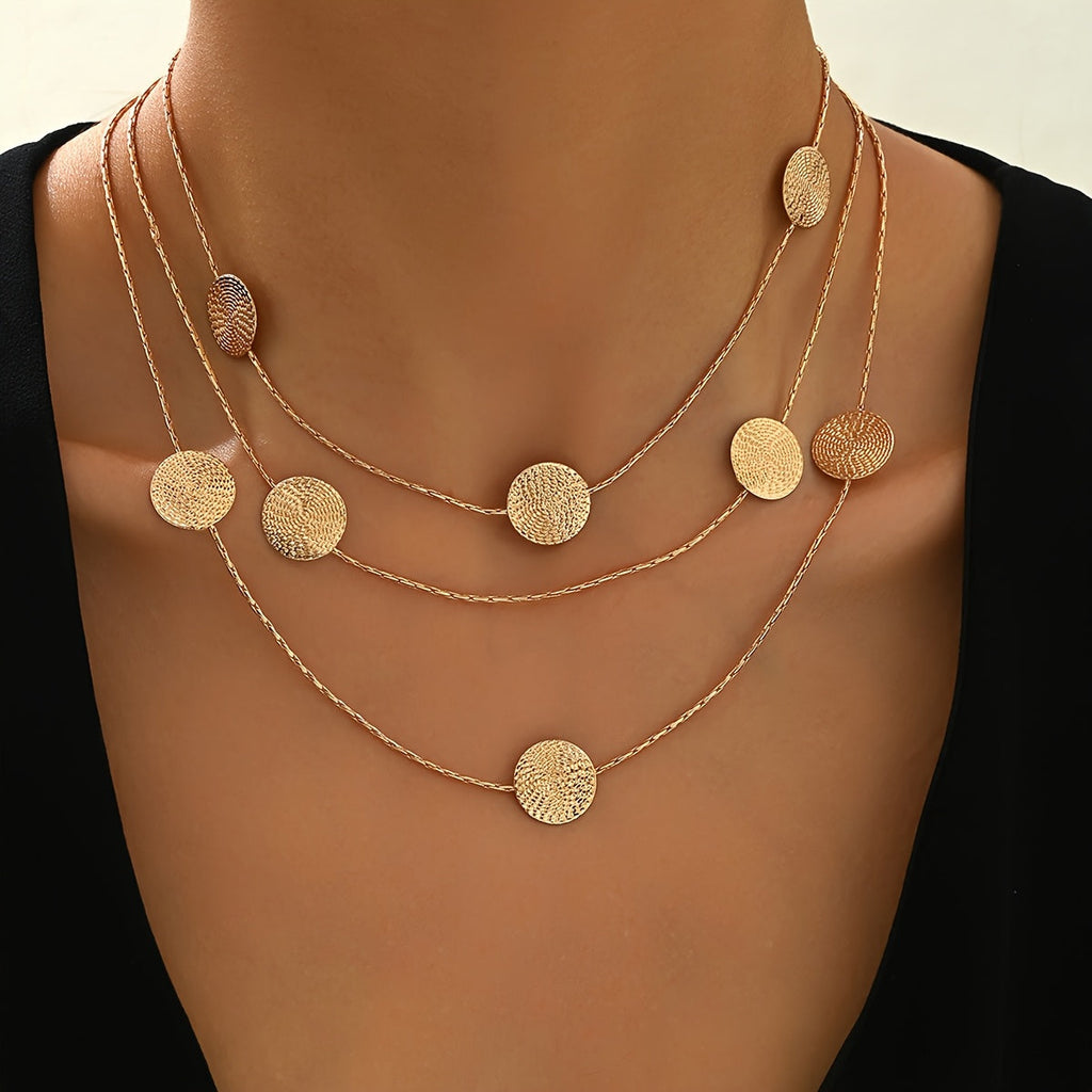 Geometrische gelaagde ketting met spiraaltextuur en meerdere schijfjes