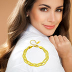 Set met slangenketting en armband in goudkleurig staal