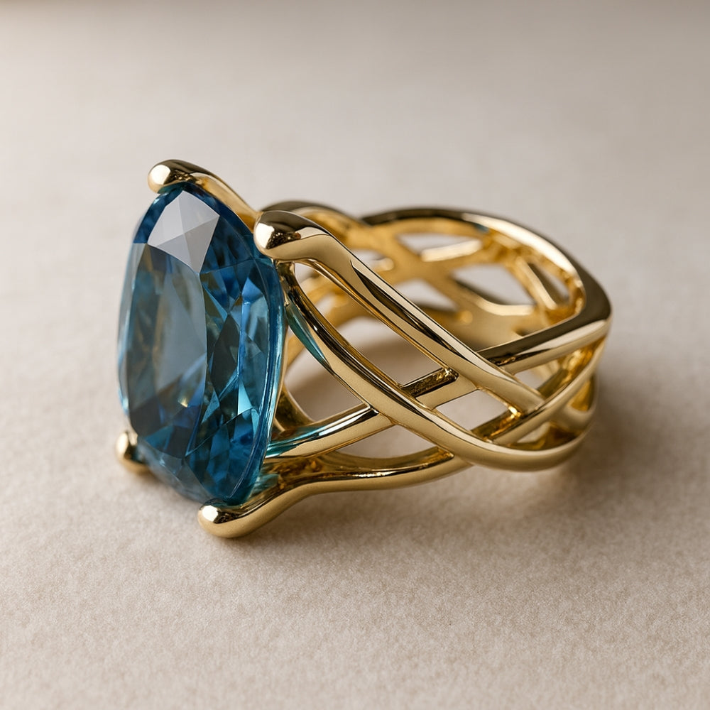 Oval Blue Zirconia Ring with Woven Gold-Tone Band