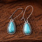 Zilverkleurige turquoise druppeloorbellen in vintagestijl
