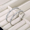 Pavé Twisted Hoop Earrings in White Gold Tone