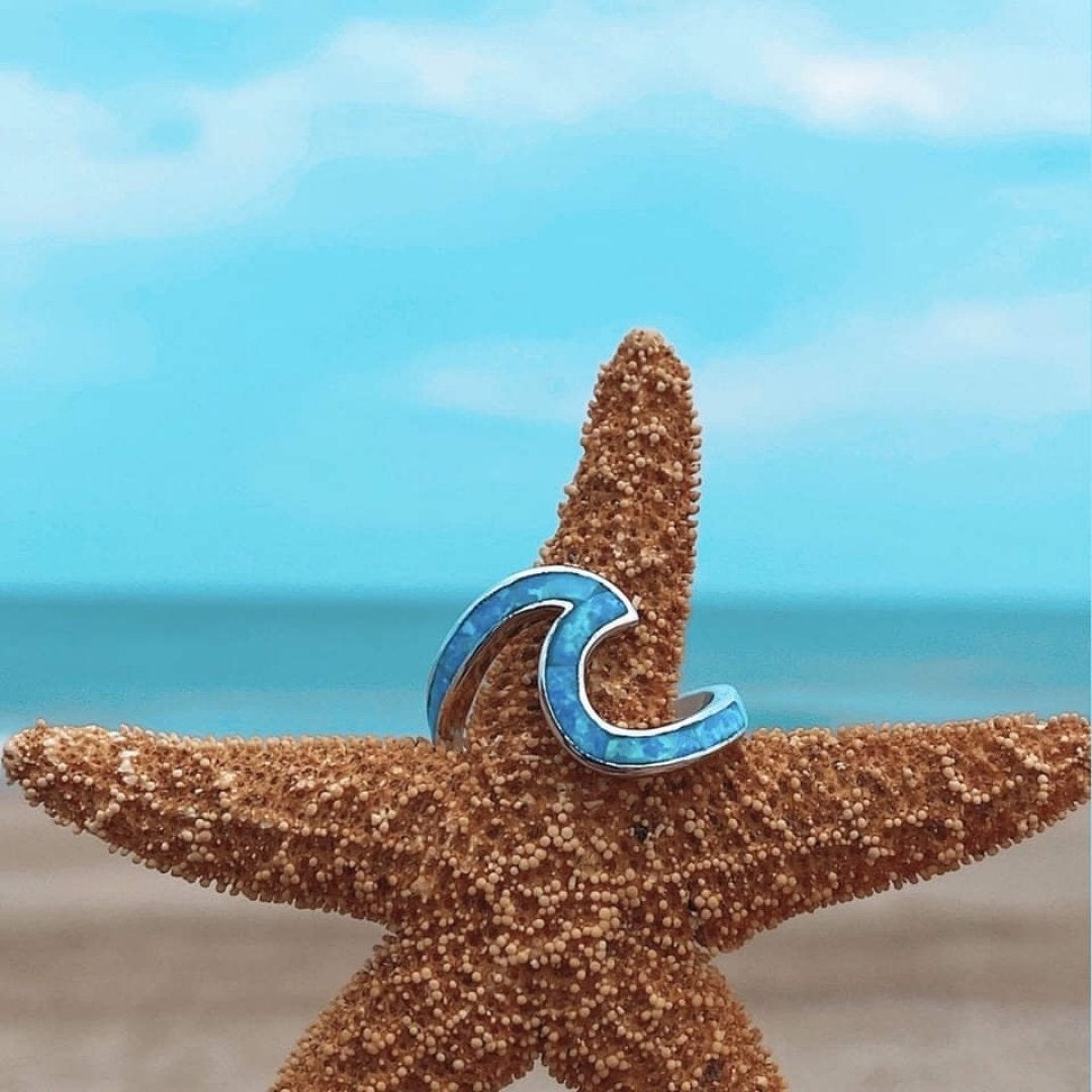 Ring met zeegolf in opaallook en zilverkleur