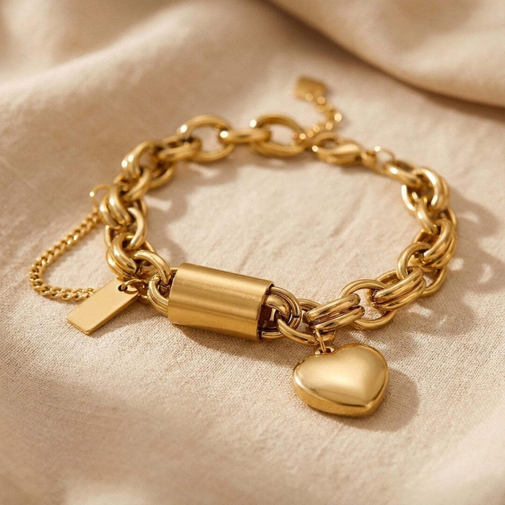 Goudkleurige schakelarmband met hartbedel