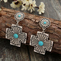 Retro gesneden bloemenoorbellen met turquoise kruis