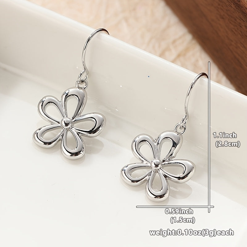 Vintage funky zilverkleurige oorbellen met bloemhanger