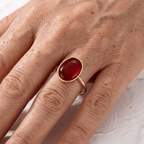 Red Oval Stone Ring on Fine Gold-Tone Band