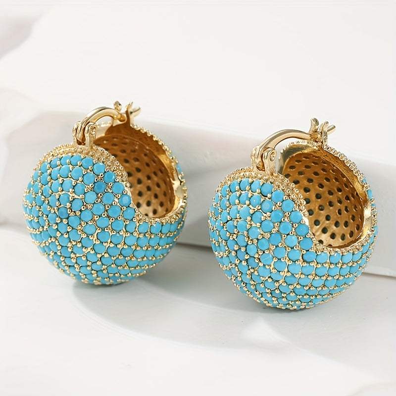Retro goudkleurige oorringen met turquoise koepel