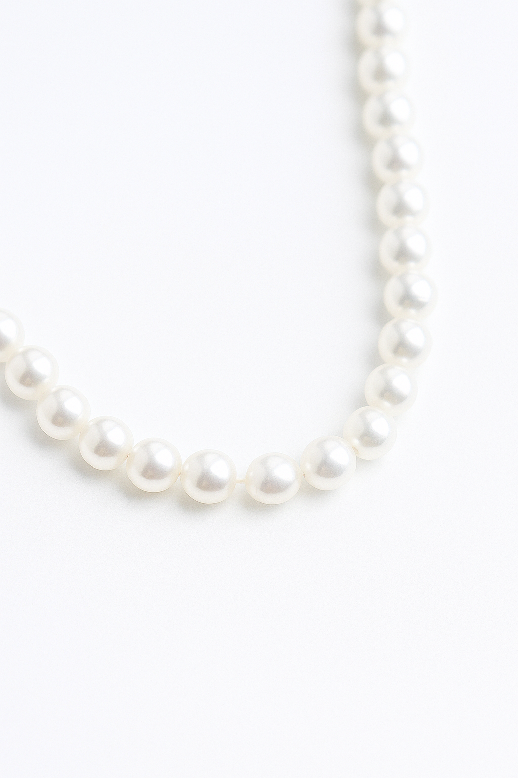 Ketting met harthanger aan kralenschakel met parellook
