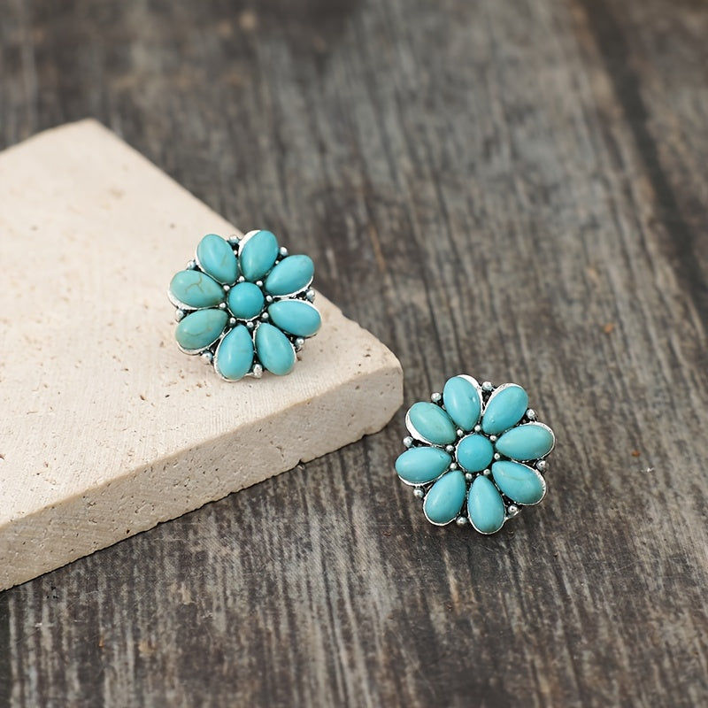 Witgoudkleurige oorknopjes met turquoise bloemblaadjes