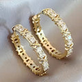 Gold-Tone Hoop Earrings with Crossed Stones