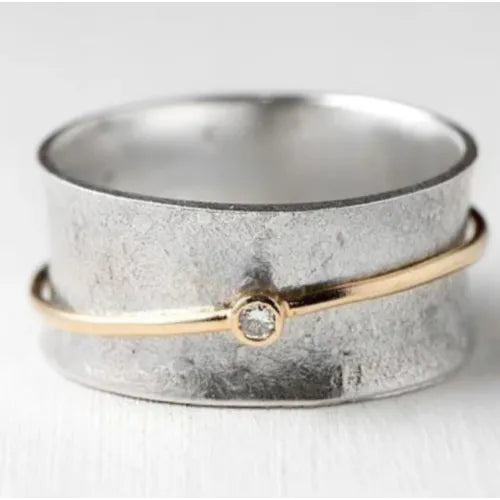 Zilverkleurige open bandring met goudkleurige bol in vintagestijl
