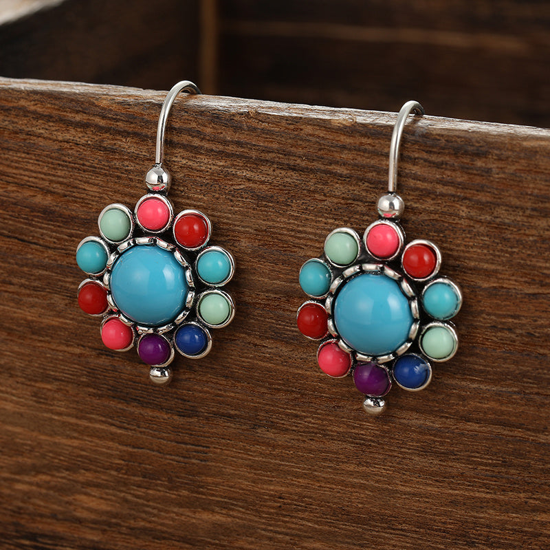 Bloemenoorhangers met turkoois en koraallook