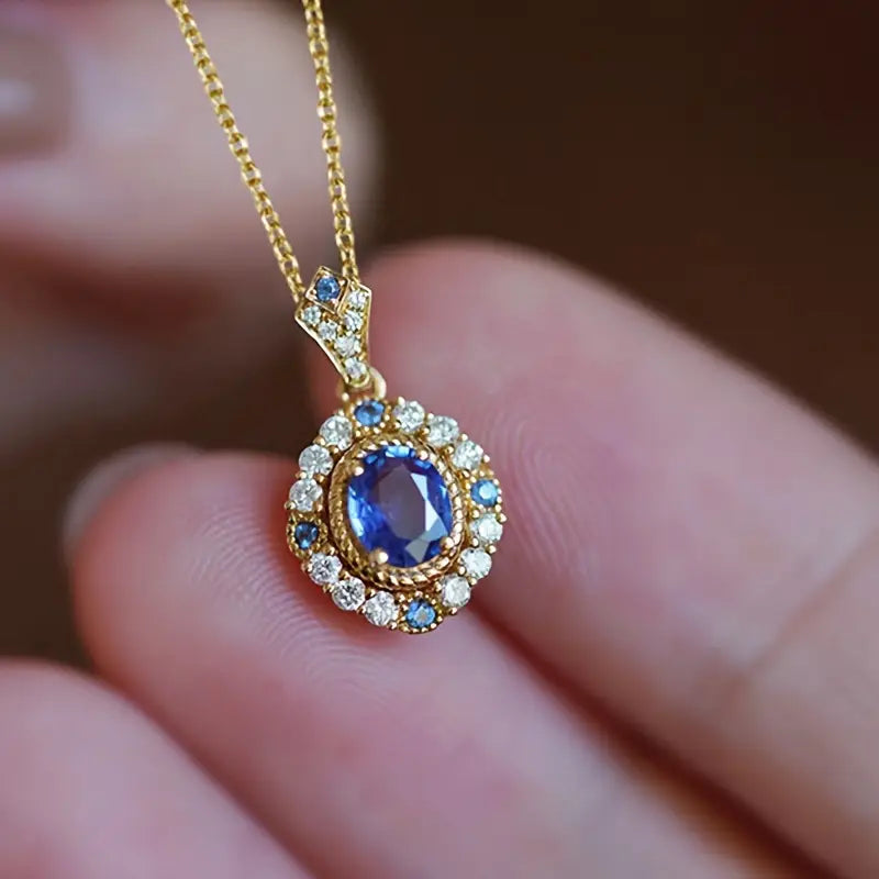 Ketting met halohanger en blauwe steen in goudkleur