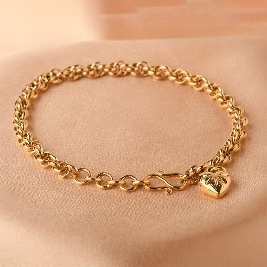 Goudkleurige schakelarmband met hartschakels