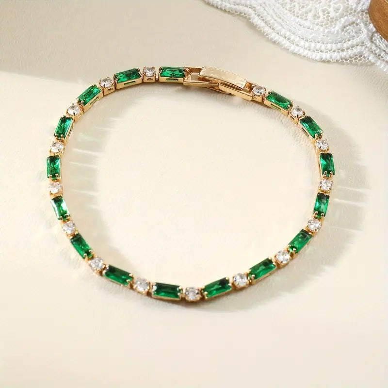 Green Baguette Stone Tennis Bracelet in Gold Tone