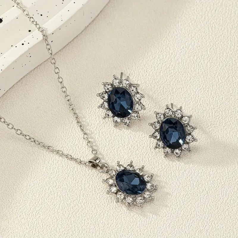Set van haloketting en oorbellen met blauwe ovale steen