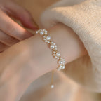 Adjustable Gold-Plated Pearl Bead Bracelet with Cat Paw