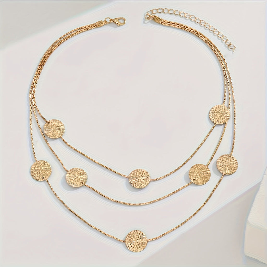 Geometrische gelaagde ketting met spiraaltextuur en meerdere schijfjes