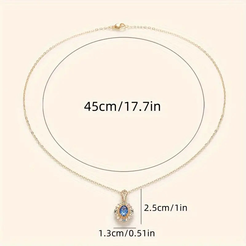 Ketting met halohanger en blauwe steen in goudkleur
