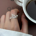 Smal sølvfarvet wrap-ring med perle