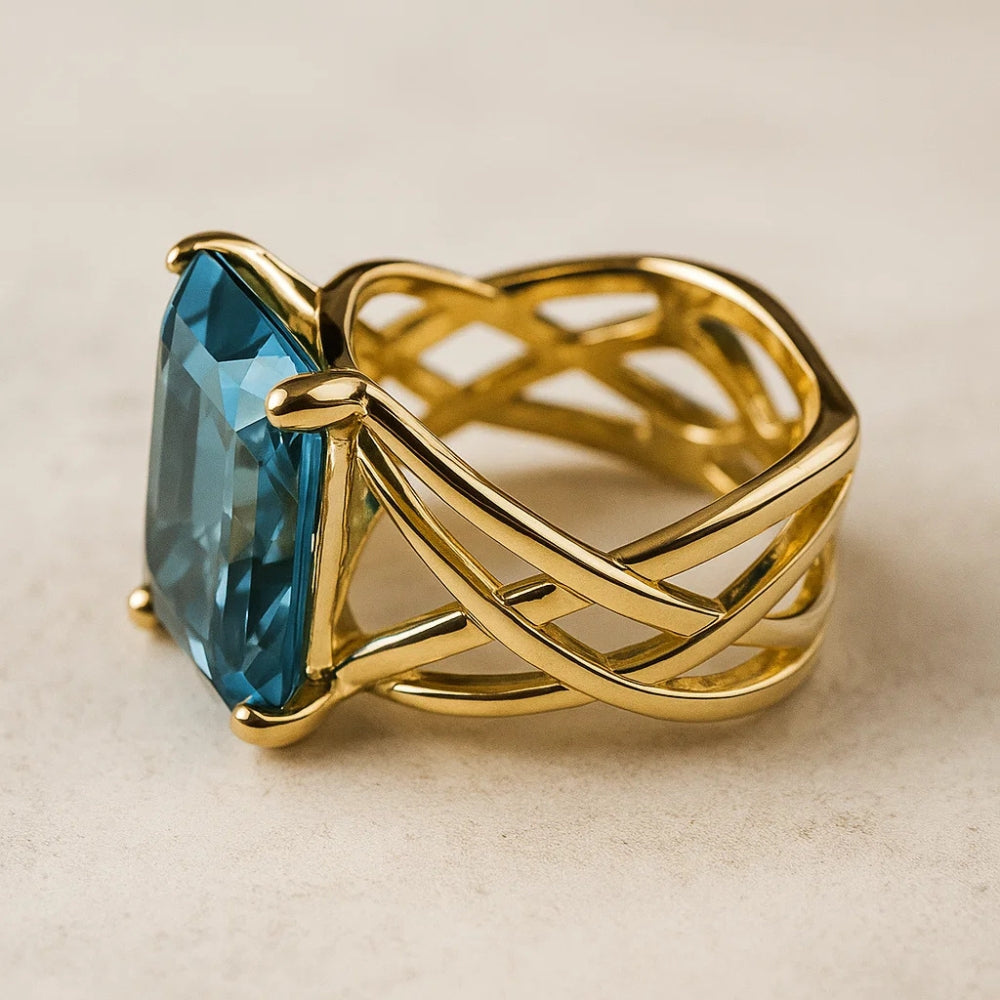 Oval Blue Zirconia Ring with Woven Gold-Tone Band