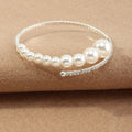 Open armband met oplopende parels