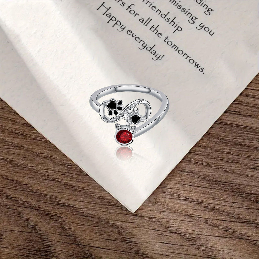 Adjustable Black Paw Print Ring with Red Stone