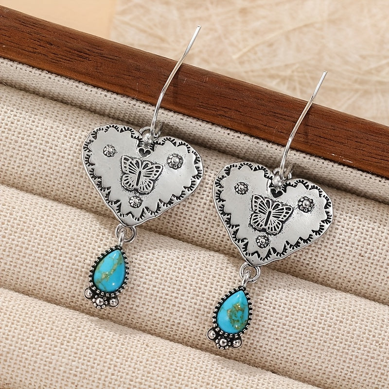 Ambachtelijke boho oorbellen met turquoise hart en vlinder