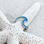 Ring met zeegolf in opaallook en zilverkleur