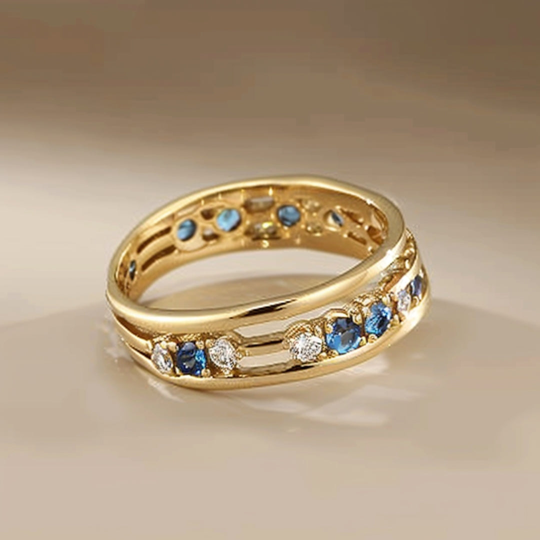 Goudkleurige ring met blauwe zirkonia