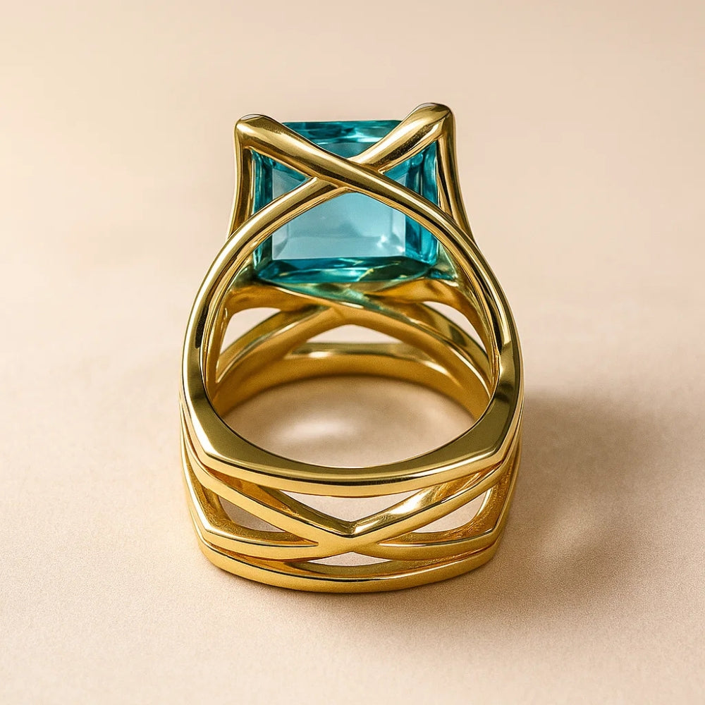 Oval Blue Zirconia Ring with Woven Gold-Tone Band