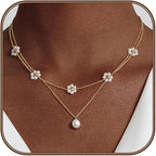 Gelaagde bloemenketting met parels in goudkleur