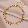 Goudkleurige armband met kleurrijke kristallen