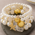 Armbandset met parel en zeester en goudkleurige accenten