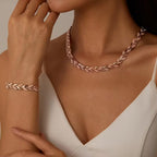 Roségoudkleurige set ketting en armband met bladschakels